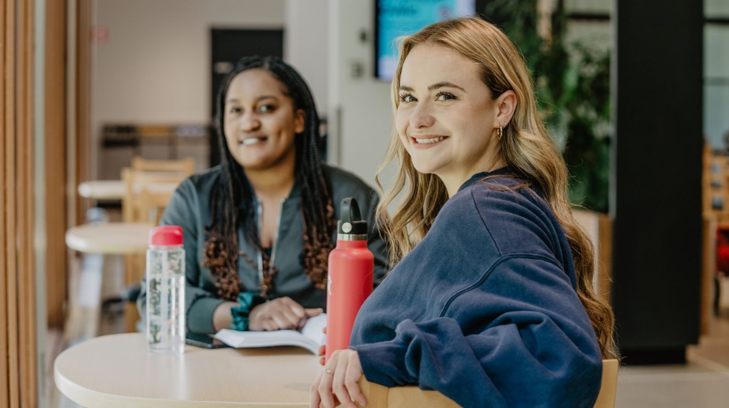  Two students in a common area